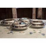 A SET OF FOUR ELECTROPLATE LARGE OVAL ENTRÉE DISHES AND TWO HANDLED COVERS, 12" LONG