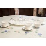 A SET OF TEN GLASS SMALL MUGS AND A WHITE CHINA PART TEA SET ORIGINALLY FOR 6 PERSONS