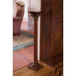 A SMALL CARVED MAHOGANY CLASSICAL COLUMN TORCHERE STAND