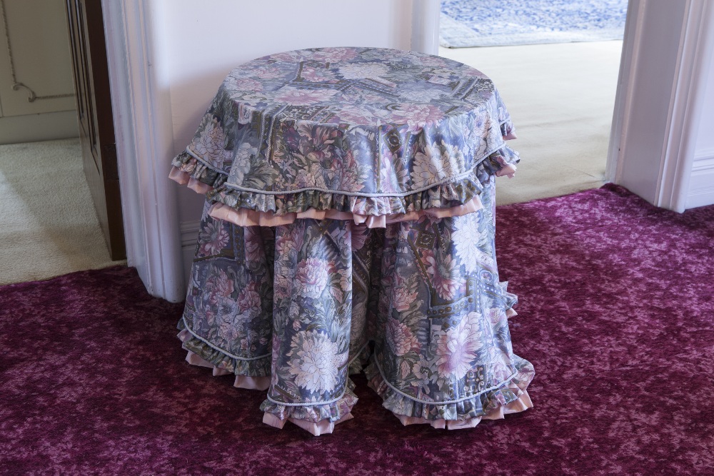 A PAIR OF MAHOGANY OCCASIONAL TABLES WITH CIRCULAR BEATEN COPPER TOPS EACH ON COLUMN AND QUARTETTE