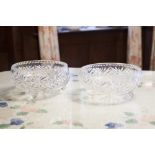 A PAIR OF LARGE CUT GLASS FRUIT BOWLS, ON SCROLL FEET