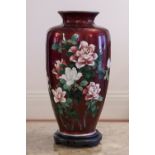 CHINESE CLOISONNÉ ENAMELLED OVULAR VASE WITH FLOWERING ROSE BUSH ON AN IRIDESCENT DARK RED