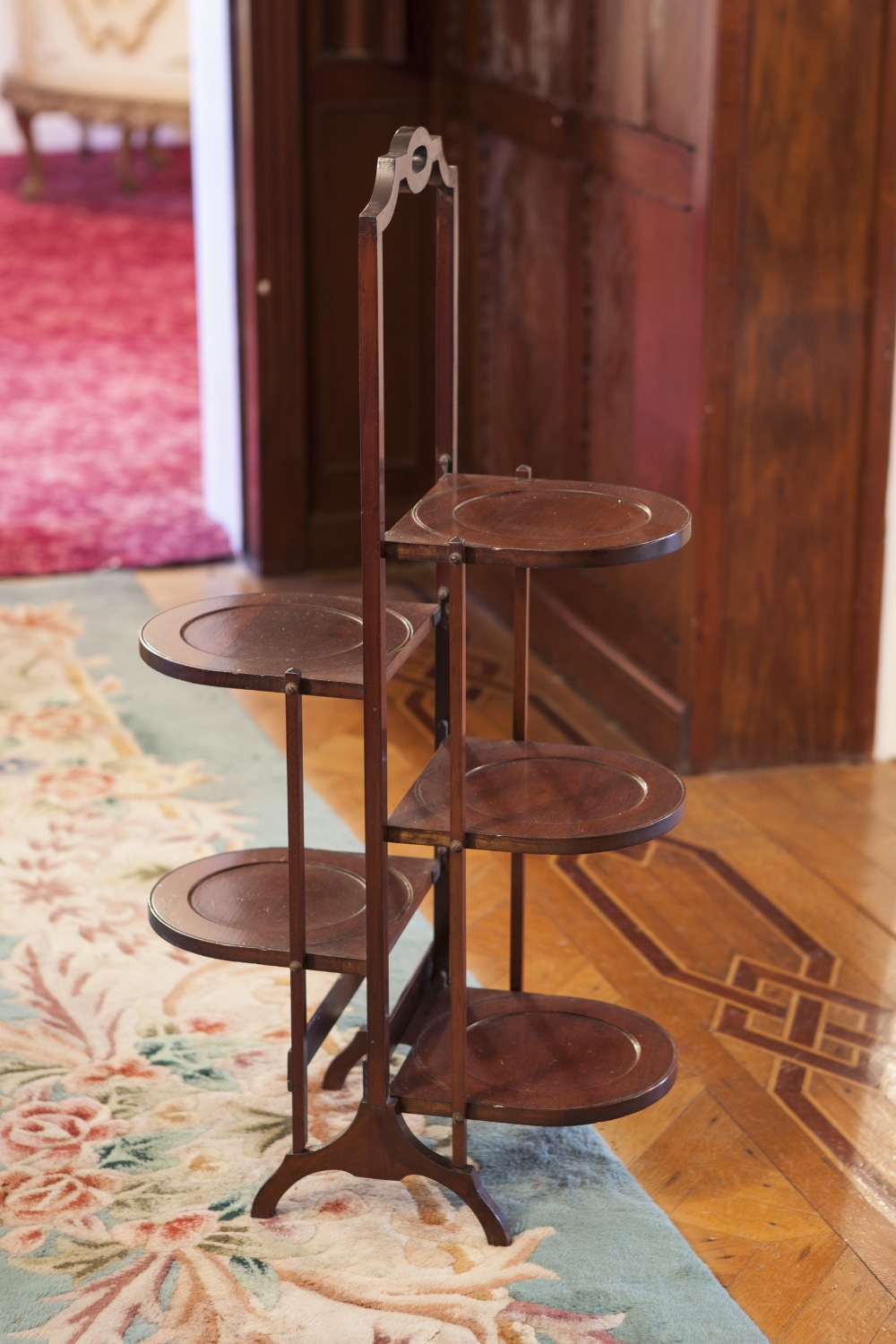 A MAHOGANY FIVE TIER FOLDING CAKE STAND, DOUBLE SIDED