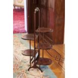 A MAHOGANY FIVE TIER FOLDING CAKE STAND, DOUBLE SIDED
