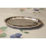 GERMAN SILVER SMALL OVAL TRAY, THE WAVY EDGE HAVING REPOUSSÉ FLORAL BORDER, 8" LONG, 800 STANDARD