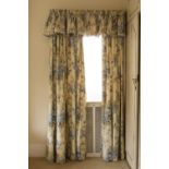 THREE PAIRS OF CREAM AND FLORAL PRINTED GLAZED COTTON CURTAINS padded and lined, one pair 7' drop,