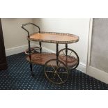 A GILT METAL AND WALNUT WOOD TWO TIER COCKTAIL TROLLEY