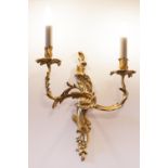 A PAIR OF ORMOLU ROCOCO WALL LIGHTS WITH TWO REFLEX, FOLIATE SCROLL, BRANCHES