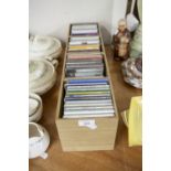 A CD STORAGE RACK WITH APPROX 42 CD's, VARIOUS GENRES INCLUDING SHIRLEY BASSEY, MICHAEL BUBLE,