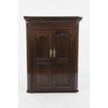 LATE EIGHTEENTH CENTURY OAK CORNER CUPBOARD, the dentil moulded cornice above a pair of cupboard