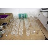 A QUANTITY OF CUT AND MOULDED STEM WINE GLASSES TO INCLUDE; CHAMPAGNE GLASSES, VARIOUS ENGRAVED