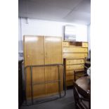 A TEAK AND PLYWOOD 1950's BEDROOM SUITE OF THREE PIECES, VIZ A DOUBLE WARDROBE, DRESSING TABLE AND