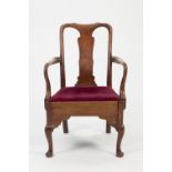 EIGHTEENTH CENTURY PROVINCIAL WALNUT OPEN ARMCHAIR IN THE QUEEN ANNE STYLE, of typical form with