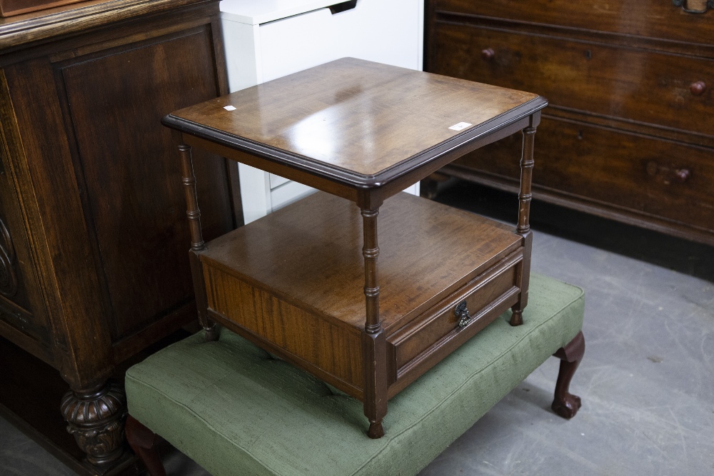 AN EDWARDIAN MAHOGANY AND WALNUTWOOD TWO TIER SIDE TABLE, solid top raised on turned supports, the