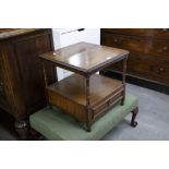 AN EDWARDIAN MAHOGANY AND WALNUTWOOD TWO TIER SIDE TABLE, solid top raised on turned supports, the