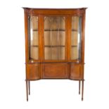 EDWARDIAN LINE INLAID MAHOGANY INVERSE BREAKFRONT DISPLAY CABINET, the moulded cornice above a