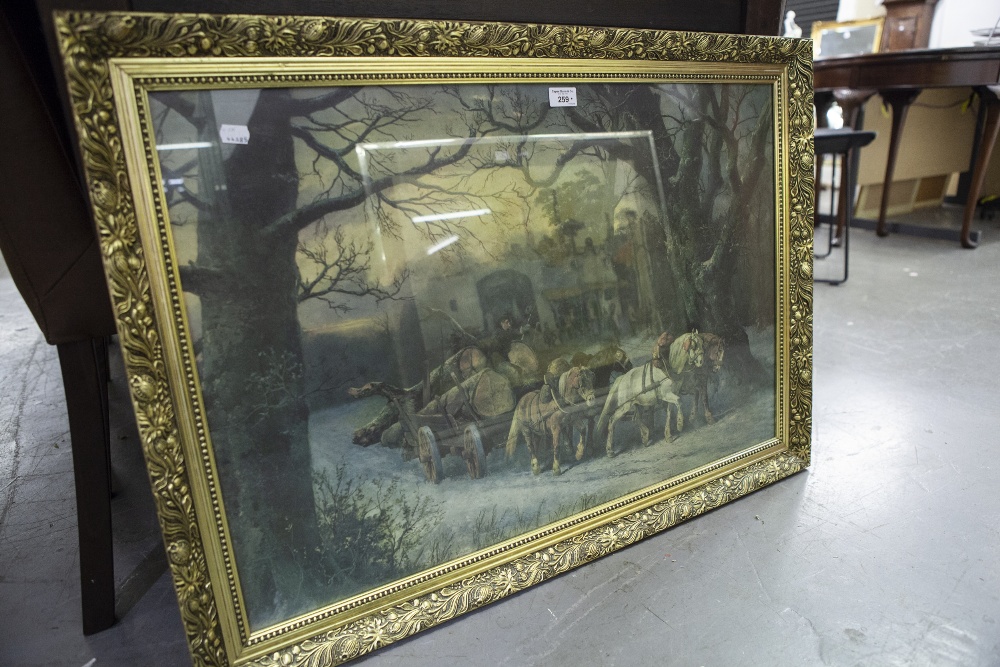 LARGE GILT FRAMED COLOUR PRINT REPRODUCTION OF A HORSE DRAWN LOGGING WAGON, IN A SNOWY LANDSCAPE 21"