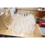 QUANTITY OF ETCHED AND CUT GLASS - DRINKING GLASSES, CHAMPAGNE FLUTES ETC....