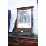 AN EDWARDIAN WALL HANGING MIRROR WITH LIDDED COMPARTMENT