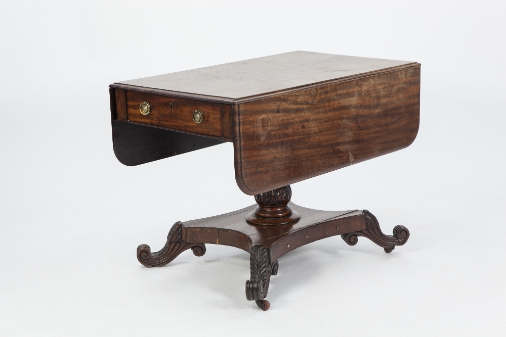 EARLY NINETEENTH CENTURY MAHOGANY PEDESTAL PEMBROKE TABLE, the rounded oblong drop leaf top above