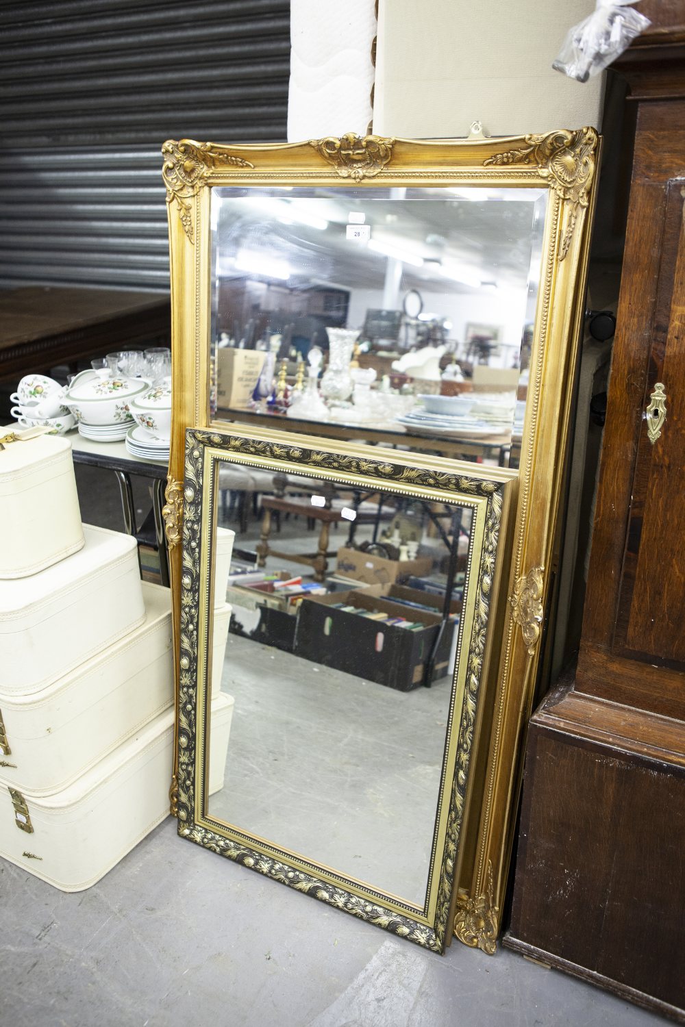 A LARGE GILT FRAMED WALL MIRROR AND A SMALLER GILT FRAMED MIRROR (2)