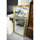 A LARGE GILT FRAMED WALL MIRROR AND A SMALLER GILT FRAMED MIRROR (2)