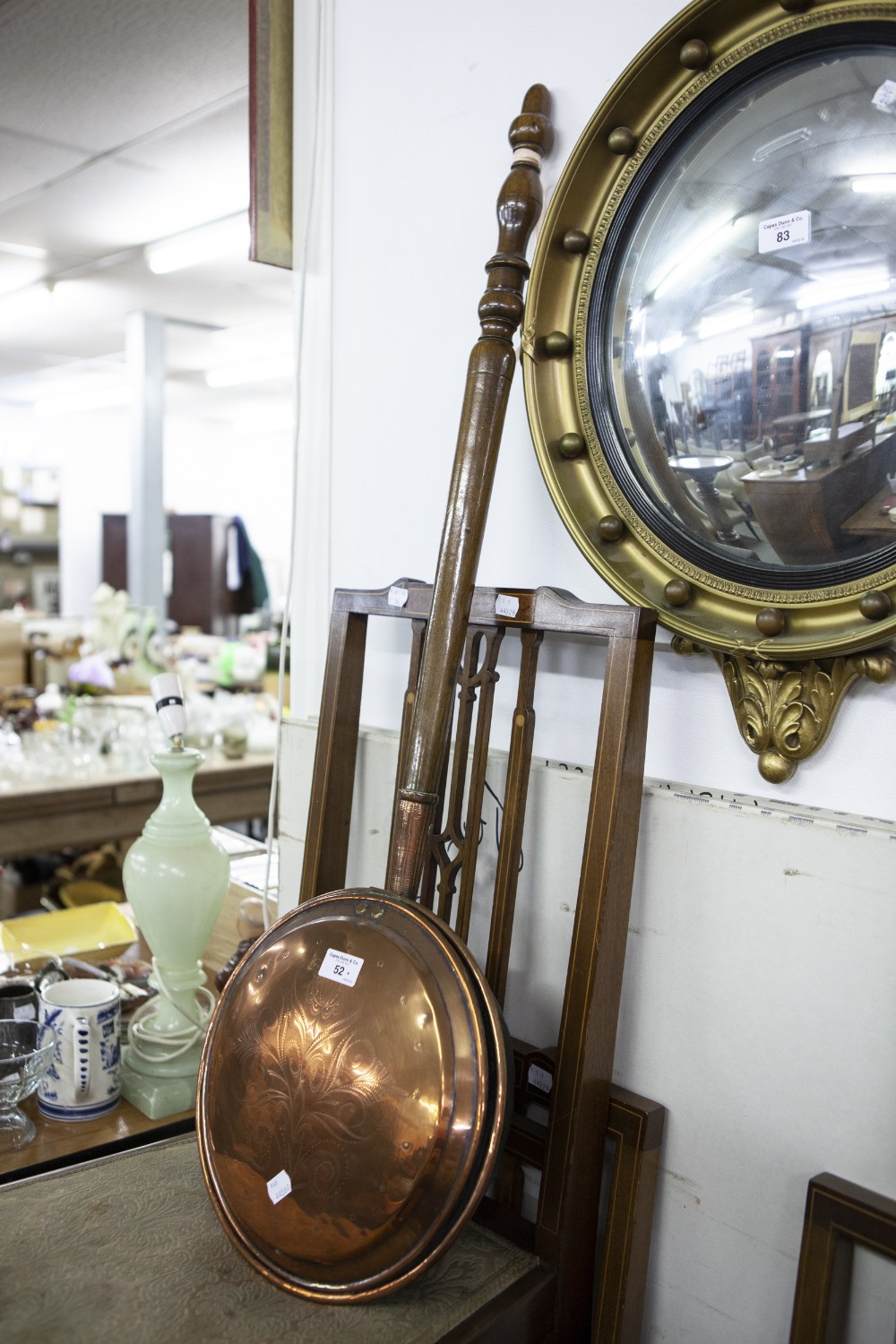 AN ANTIQUE ENGRAVED COPPER BED WARMING PAN, WITH LONG TURNED WOODEN HANDLE