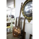 AN ANTIQUE ENGRAVED COPPER BED WARMING PAN, WITH LONG TURNED WOODEN HANDLE