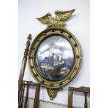 AISONEA, REGENCY STYLE GILT CONVEX WALL MIRROR, the circular plate in a moulded frame with