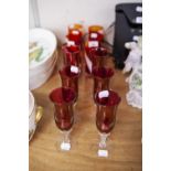 A SET OF SIX VENETIAN RUBY GLASS TALL TUMBLERS WITH WHITE SPIRAL DECORATION AND SIX VENETIAN RUBY