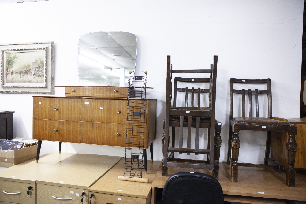 A 1970's DRESSING CHEST, SHAPED MIRROR OVER SHORT DRAWERS, THE BASE HAVING TWO LONG DRAWERS ON