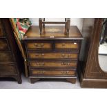 A SMALL GEORGIAN STYLE MAHOGANY CHEST OF TWO SHORT AND THREE LONG DRAWERS