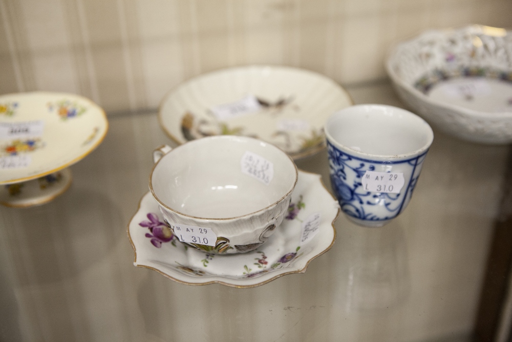 MEISSEN MOULDED PORCELAIN TEA CUP AND SAUCER, decorated with swans, teacup a/f, LATER FLORAL PRINTED