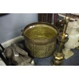 LARGE EARLY TWENTIETH CENTURY INDIAN EMBOSSED BRASS LOG TUB, cauldron shaped with free ring handles,