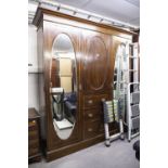 LATE NINETEENTH CENTURY INLAID OAK BEACONSFIELD TYPE WARDROBE WITH TWO OVAL MIRROR PANEL DOORS (A.