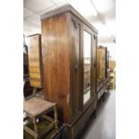 A BLIND FRET CARVED OAK BEDROOM SUITE OF 3 PIECES, VIZ A MIRROR DOOR WARDROBE WITH DRAWER BELOW, A