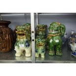 THREE PAIRS OF CHINESE STYLE GREEN, OCHRE AND BLUE GLAZED BUDDHISTIC LIONS