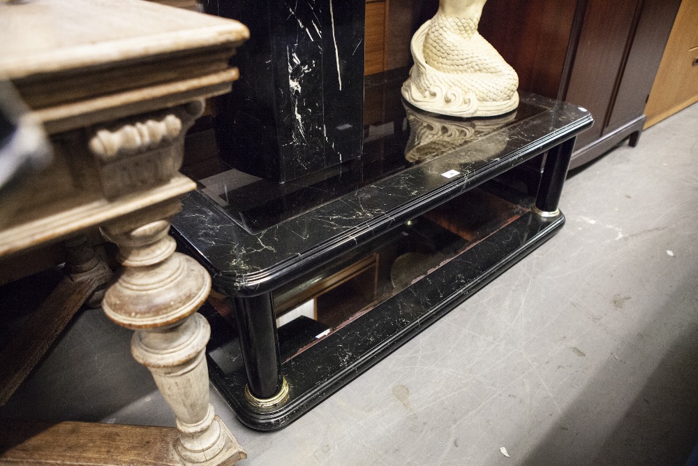 A BLACK LACQUERED OBLONG COFFEE TABLE WITH INSET BEVELLED PLATE GLASS TOP AND MIRROR INSET