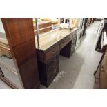 A TWENTIETH CENTURY MAHOGANY DOUBLE PEDESTAL DESK WITH NINE DRAWERS, ON PLINTH BASES, 5;6" X 1'8"