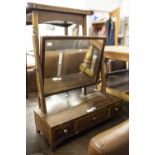 A GEORGIAN MAHOGANY DRESSING TABLE MIRROR ON STAND, BRASS URN FINIALS, ON SQUARE GLASS OVER BASE