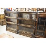 A PAIR OF GLOBE WERNICKE THREE TIER SECTIONAL BOOKCASES WITH LEAD GLAZED DOORS (2)