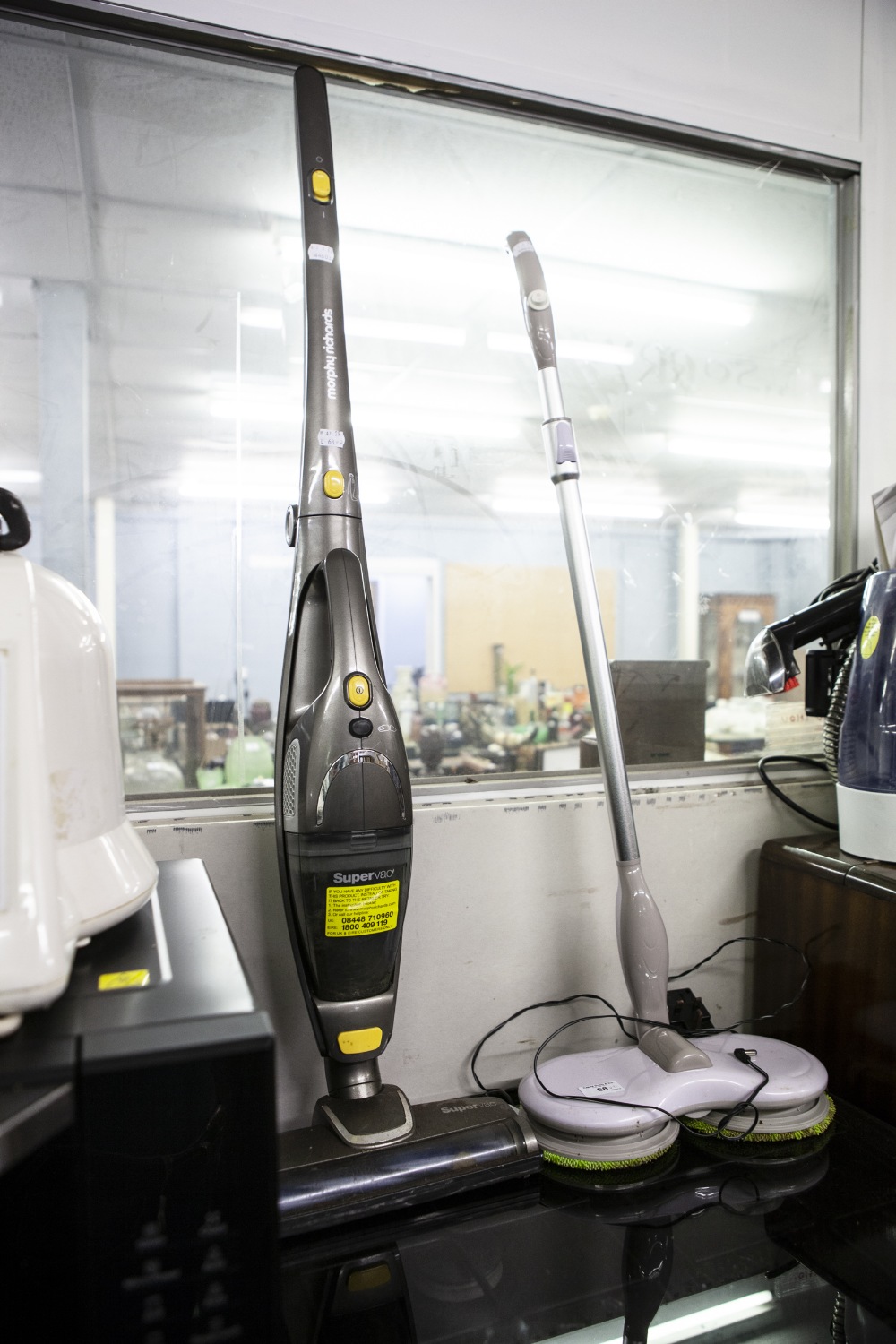 A CORDLESS FLOOR POLISHER AND A SUPERVAC CORDLESS VACUUM CLEANER