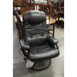 A BLACK LEATHER EASY ARMCHAIR