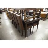 A MODERN TWENTIETH MAHOGANY DINING TABLE, ON FLUTED SUPPORTS AND A SET OF TEN DINING CHAIRS, HIGH
