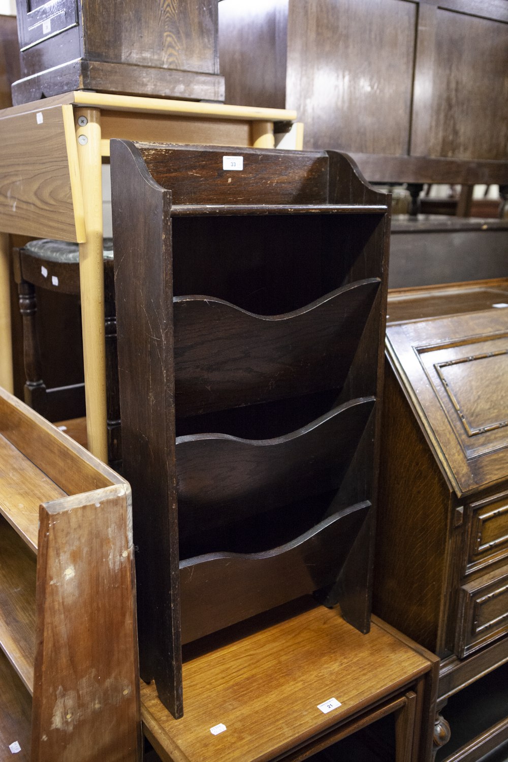 AN OAK THREE TIER PERIODICAL RACK AND AN OAK OBLONG STOOL
