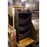 AN OAK THREE TIER PERIODICAL RACK AND AN OAK OBLONG STOOL