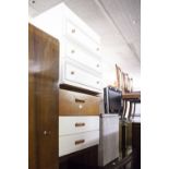 A TEAK AND WHITE FINISH CHEST OF THREE LONG DRAWERS; A WHITE MELAMINE CHEST OF THREE LONG DRAWERS