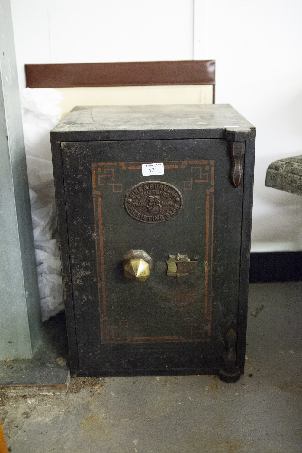 SMALL STEEL SAFE WITH BRASS KNOB HANDLE, 2' HIGH (OPEN BUT NO KEY PRESENT)