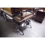 A SINGER DROP-HEAD TREADLE SEWING MACHINE