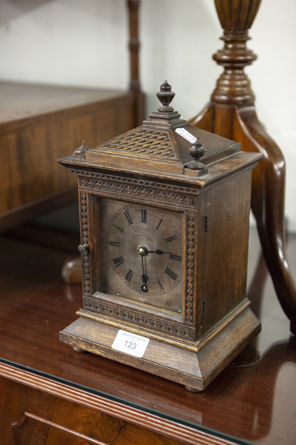 EARLY 20th CENTURY OAK CASED MANTLE CLOCK, the glazed door enclosing silvered plate with black Roman